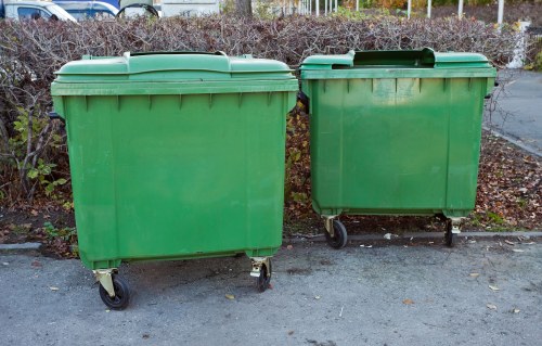 Fleet of sustainable waste collection vehicles at a commercial site in Edmonton